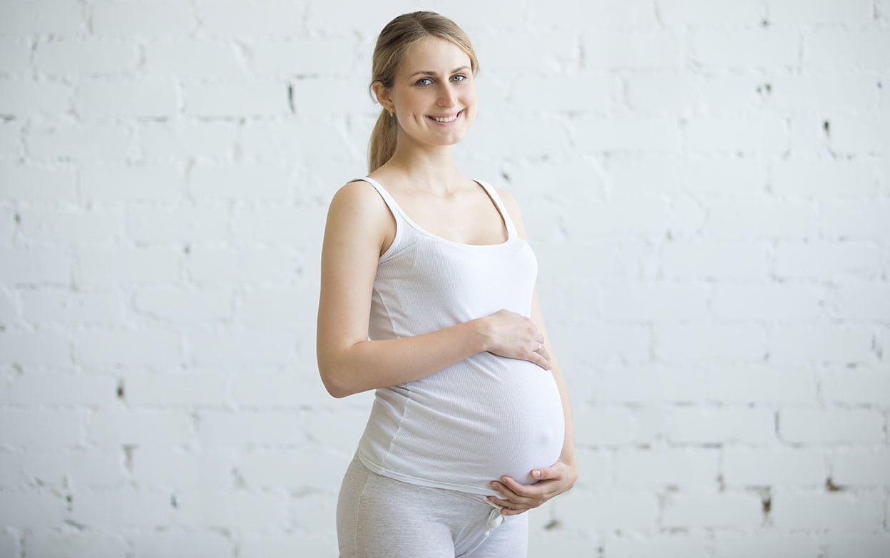 Pregnant young woman portrait indoors